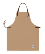 Handcrafted, trade brown canvas apron; made in Britain with pockets and removable leather straps.