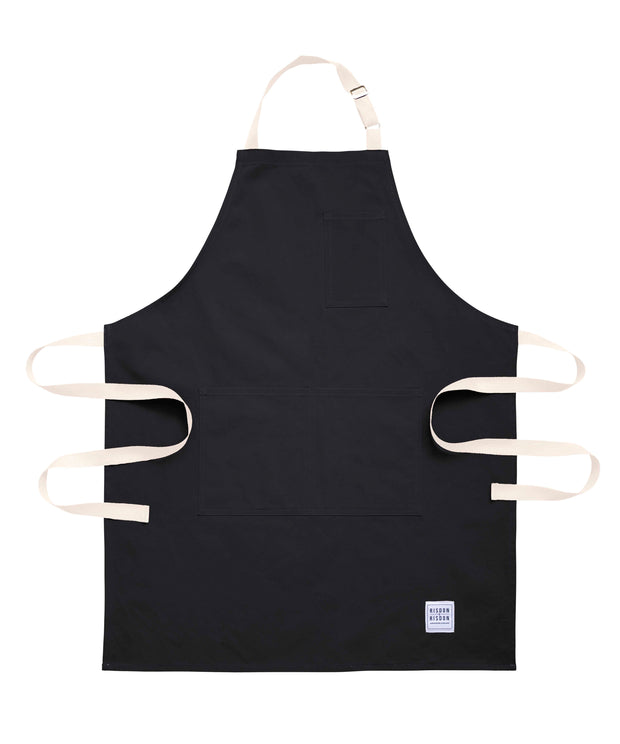 Handcrafted black canvas apron with white straps: made in Britain.