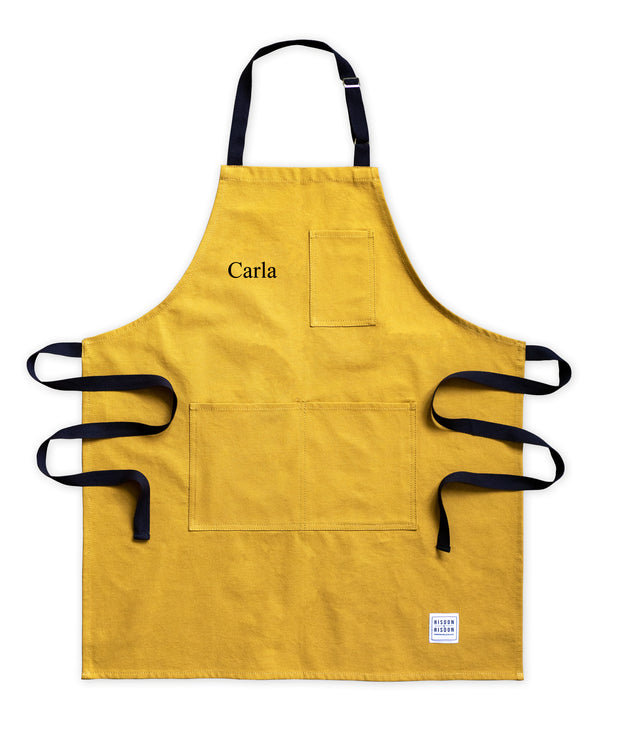 A handcrafted yellow canvas apron made in britan