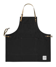 Children's handcrafted black canvas apron with removable cork straps: made in Britain.