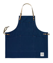 Children's handcrafted blue canvas apron with removable cork straps: made in Britain.