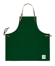 Children's handcrafted green canvas apron with removable cork straps: made in Britain.
