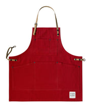 Children's handcrafted red canvas apron with removable cork straps: made in Britain.