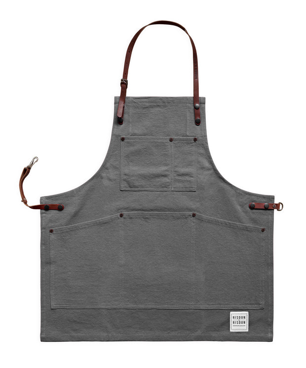 Children's handcrafted grey canvas apron with removable leather straps: made in Britain.