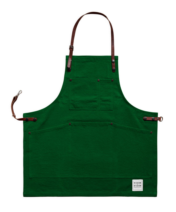 Children's handcrafted green canvas apron with removable leather straps: made in Britain.