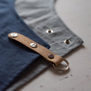Handcrafted, canvas aprons; made in Britain with pockets and cork trim and straps.