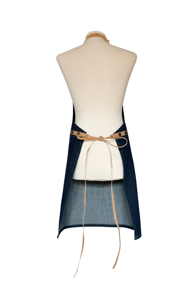 Handcrafted, denim apron; made in Britain with pockets and removable cork straps.