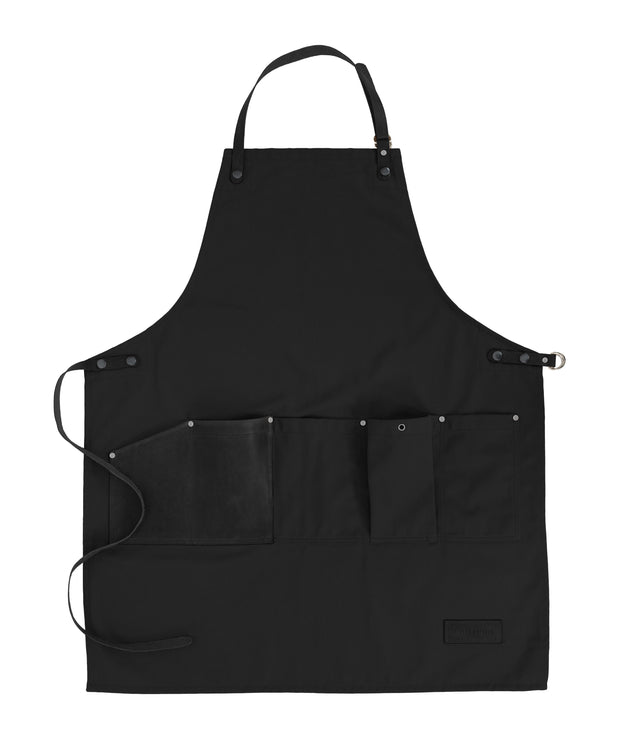 Handcrafted, black canvas apron; made in Britain with removable, leather straps and pocket.