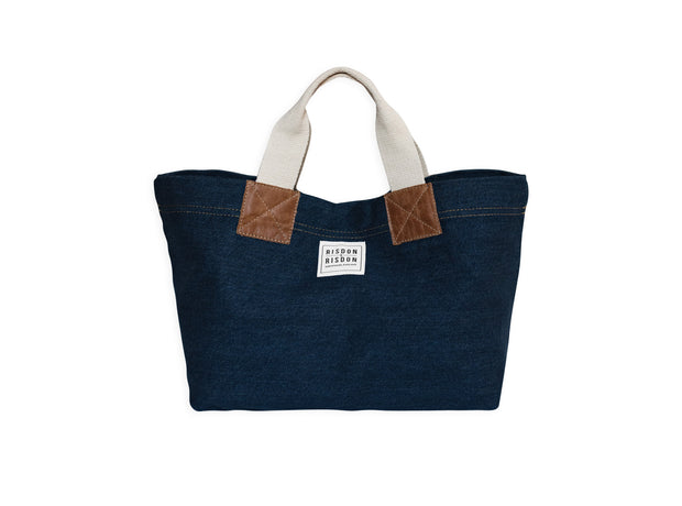 A handcrafted denim and canvas mini market bag