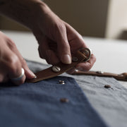 Handcrafted, canvas aprons; made in Britain with pockets and removable leather straps.