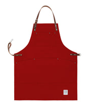 Handcrafted, factory red canvas apron; made in Britain with pockets and removable leather straps.