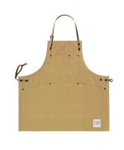 Children's handcrafted trade brown canvas apron with removable cork straps: made in Britain.