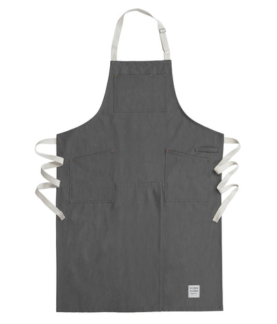 Handcrafted, grey canvas apron with white straps; made in Britain.