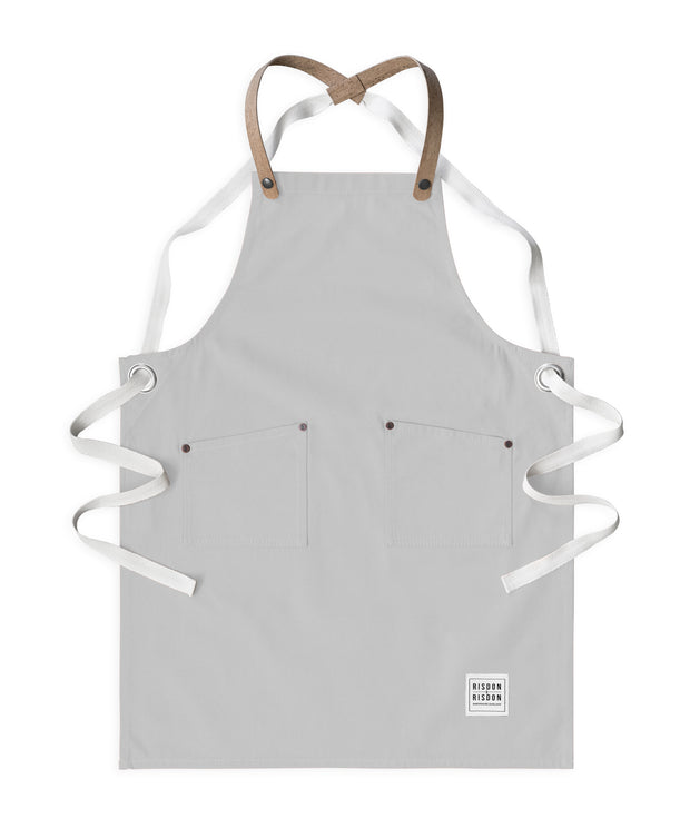 Children's handcrafted ash canvas apron with removable cork straps: made in Britain.