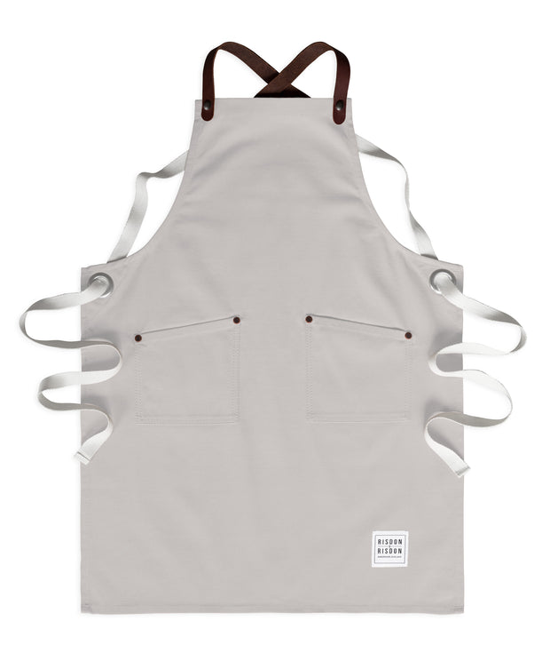 Children's handcrafted ash canvas apron with removable leather straps: made in Britain.