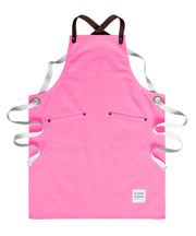 Children's handcrafted candy / hot pink canvas apron with removable leather straps: made in Britain.
