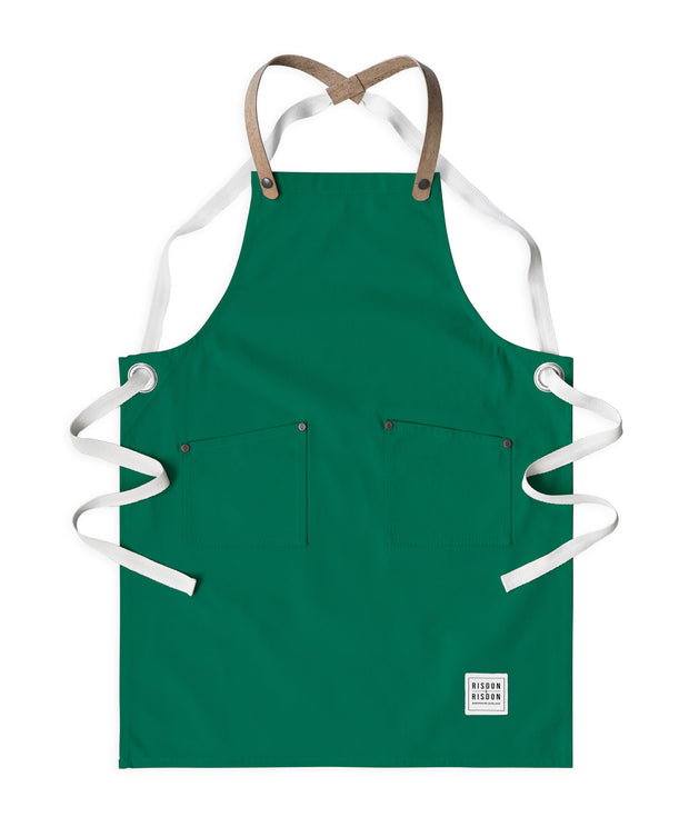 Children's handcrafted forest green canvas apron with removable cork straps: made in Britain.