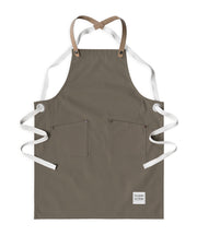 Children's handcrafted taupe canvas apron with removable cork straps: made in Britain.