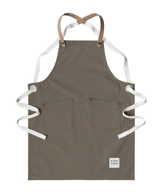 Children's handcrafted taupe canvas apron with removable cork straps: made in Britain.