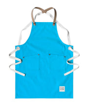 Children's handcrafted turquoise canvas apron with removable cork straps: made in Britain.