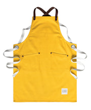 Children's handcrafted yellow canvas apron with removable leather straps: made in Britain.