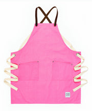 A handcrafted canvas apron with removable leather straps 
