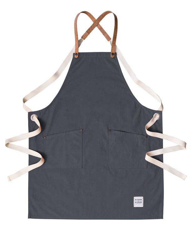 A handcrafted canvas apron with removable corck straps 