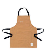 A brown canvas hancrafted apron made in britan