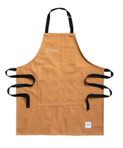 A handcrafted brown canvas apron made in britan