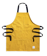 A handcrafted yellow apron made in britan