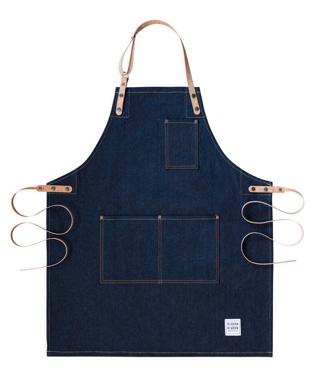 Handcrafted, heritage denim apron; made in Britain with pockets and removable cork straps.