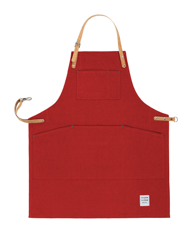 Handcrafted, factory red canvas apron; made in Britain with pockets and removable, cork straps.