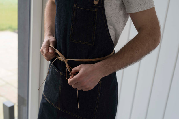 Handcrafted, denim apron; made in Britain with pockets and removable cork straps.