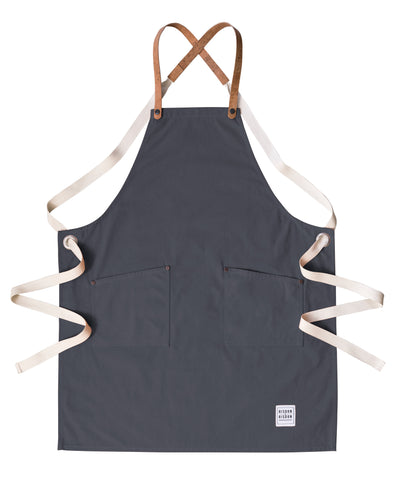 A handcrafted canvas apron with removable corck straps 