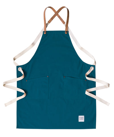 A handcrafted canvas apron with removable corck straps 