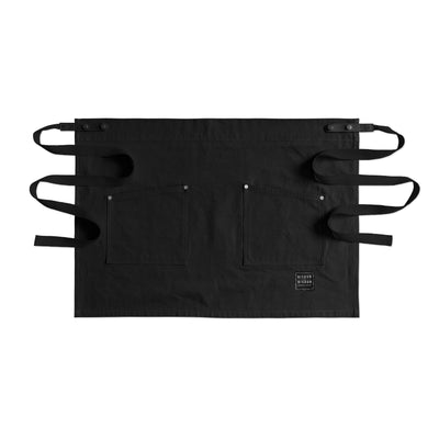 Handcrafted, black canvas waist (half)-apron; made in Britain with removable leather straps.